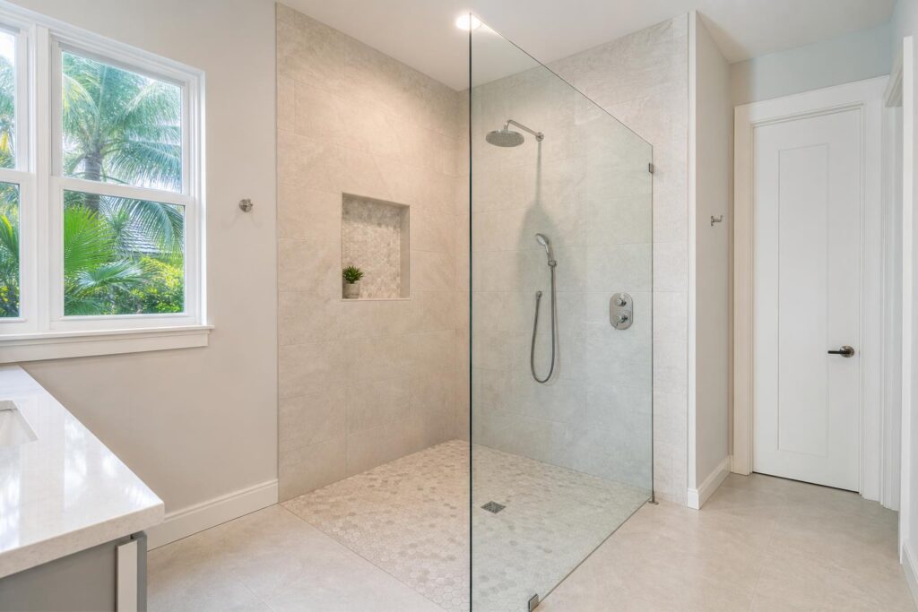 Finished walk-in shower remodel with tile and glass