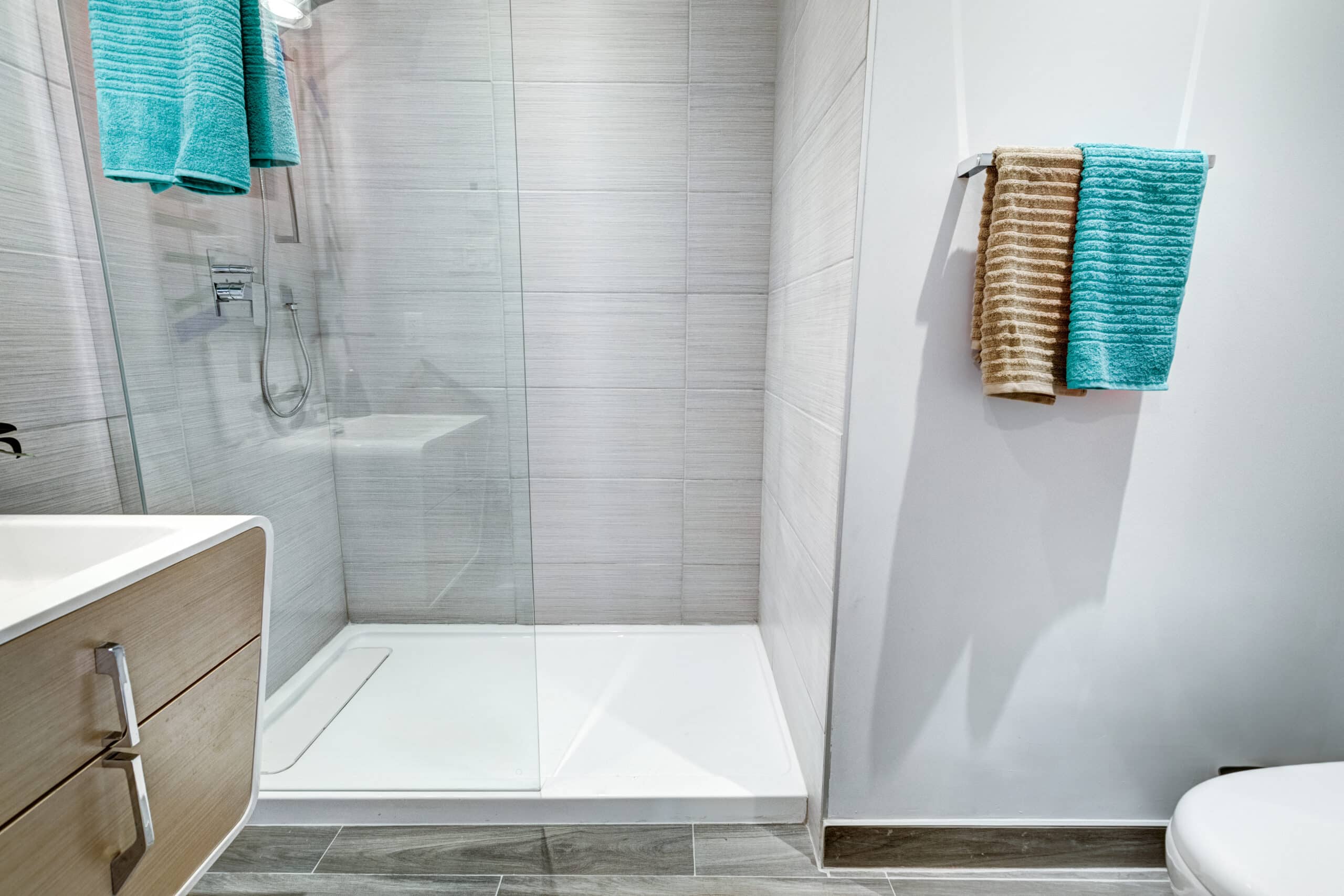 Renovated glass shower with tile walls for shower remodel planning